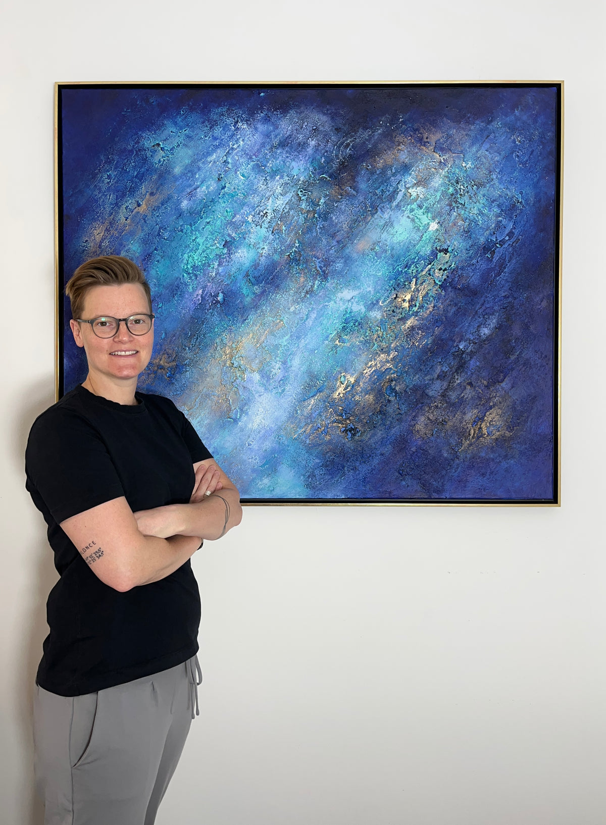 Sabine Runge, abstract artist near Munich, with one of her original paintings